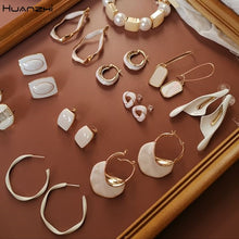 Load image into Gallery viewer, HUANZHI 2019 White Geometric Round Square Irregular Hollow Pearlescent Starry Sky Calla Lily Enamel Earrings for Women Girls
